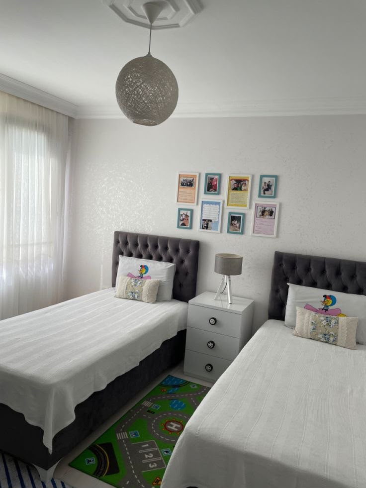 Twin bed room with tufted headboards at The Velvet Rose
