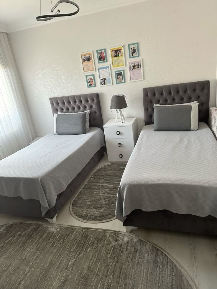 Shared room with grey tufted headboards